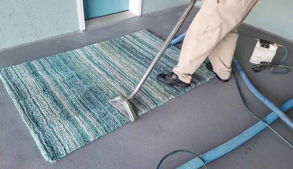 Man has small business cleaning carpets by shampooing and then steam cleaning.