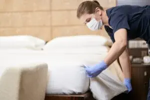 Housekeeping staff cleaning room before customers arrival